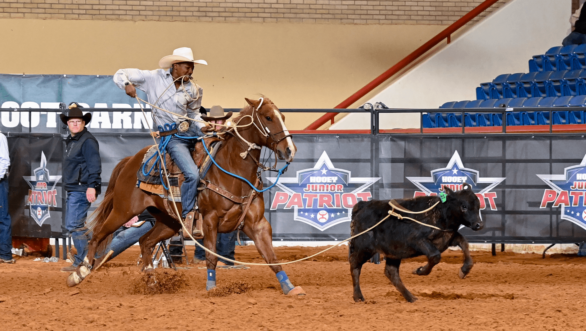 Jeffrey Hayes dismounts from mare "Lizzo" on his way to posting the fastest tie-down time of the day; a 7.76-second run.