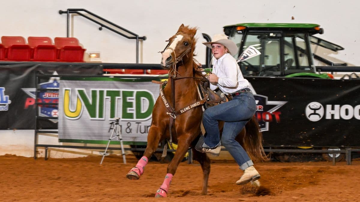 Ella Kay prepares to dismount "Lipstick" in the Hooey Jr. Patriot 15-and-Under Goat Tying Semifinals.