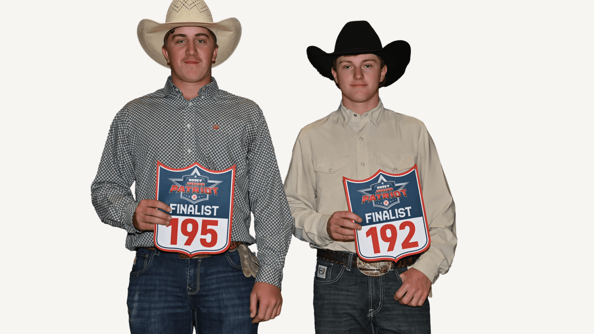 Two cowboys in western attire holding Cinch Patriot finalist placards numbered 195 and 192