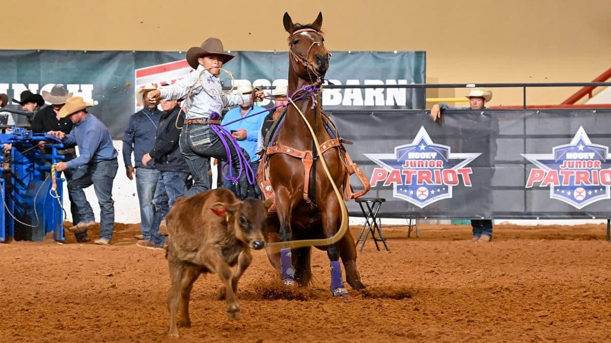 With a combined age of 15, 10-year-old Jackson Ashton and 5-year-old "Moto" won the Hooey Jr. Patriot 12-and-Under Tie-Down Jackpot Championship.