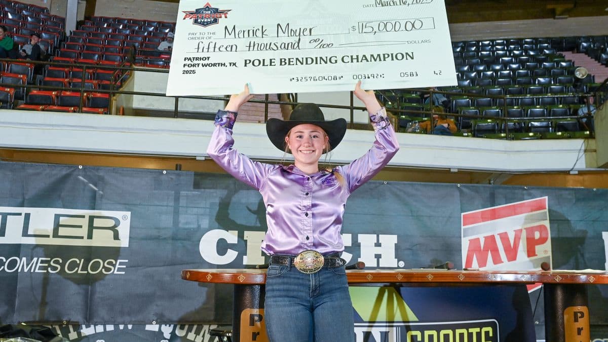 Merrick Moyer with her Hooey Jr. Patriot 19-&-Under Pole Bending check.