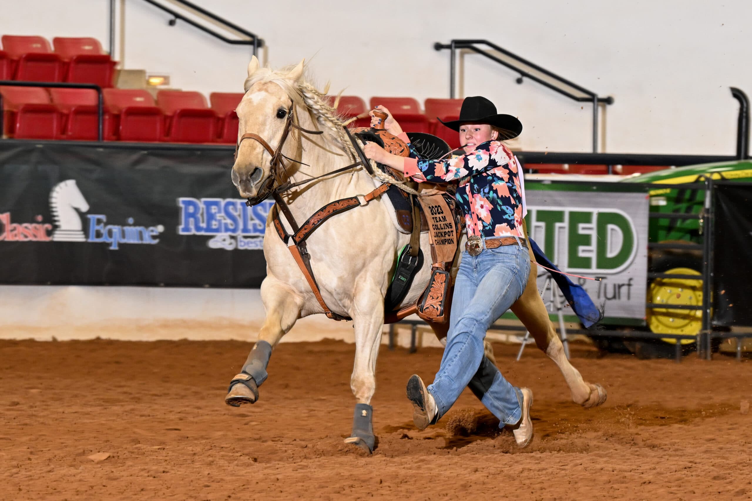 Sadie Patterson dismounts "Princess" on her way to a 6.16-second time in the 19-and-Under goat tying.