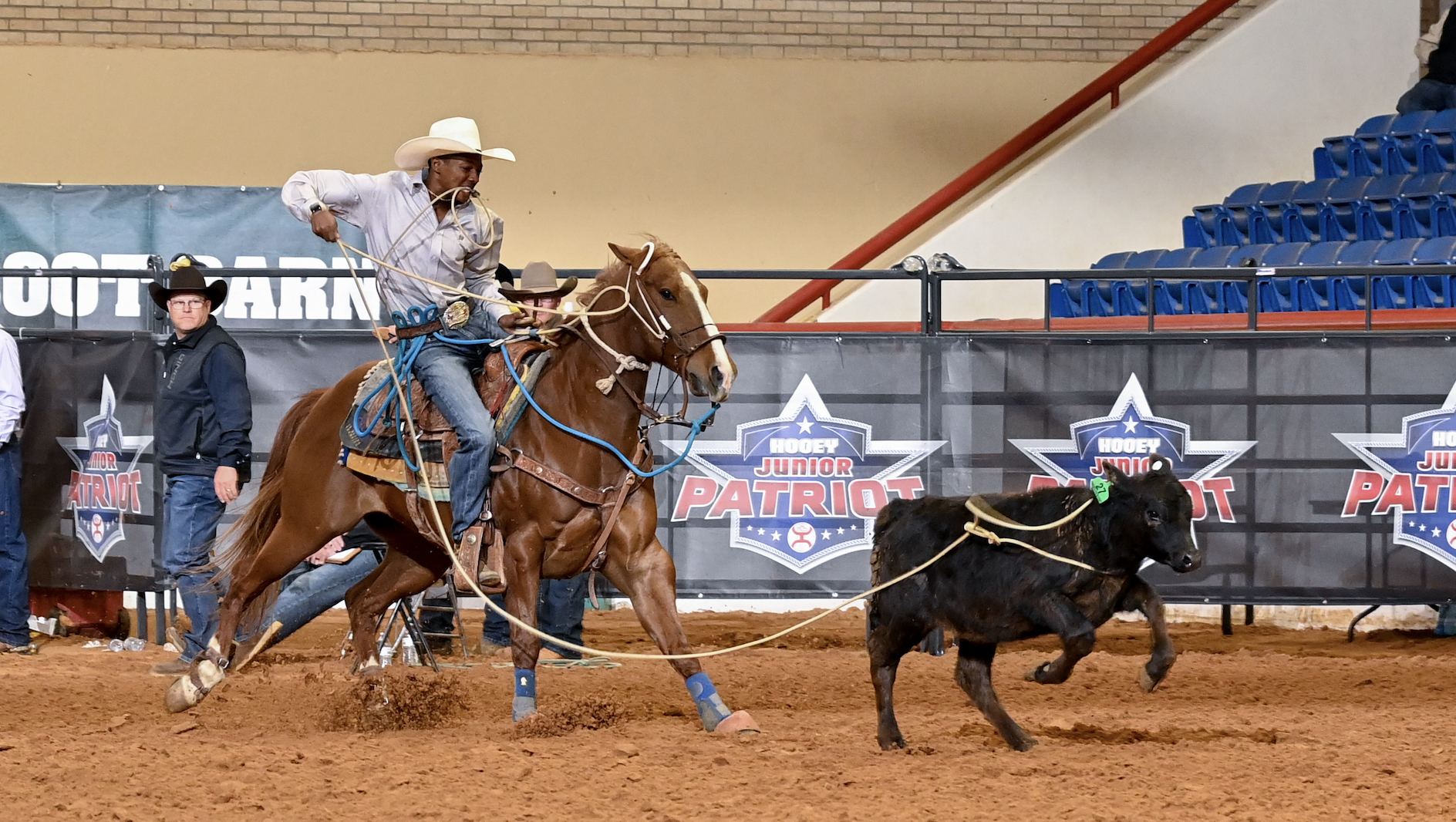 Jeffrey Hayes dismounts from mare "Lizzo" on his way to posting the fastest tie-down time of the day; a 7.76-second run.